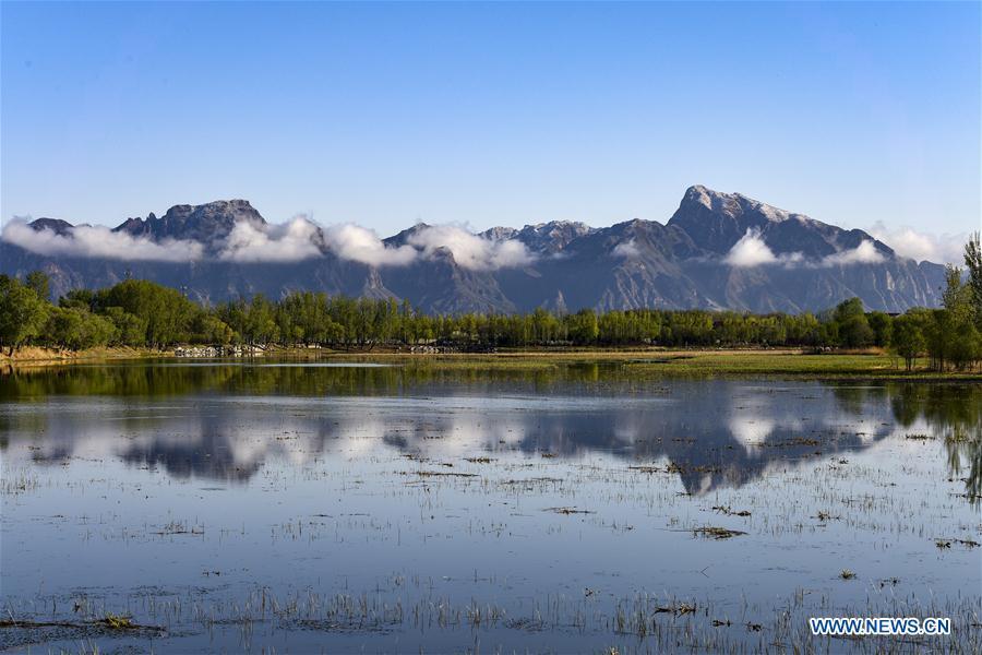 Photo taken on April 25, 2019 shows the scenery of Guishui River in Yanqing District of Beijing, capital of China. The International Horticultural Exhibition 2019 Beijing, the largest expo of its kind in the world, opened to the public Monday in Yanqing District. Yanqing boasts itself as being home to parts of the Great Wall. It is a summer resort and the agricultural base of Beijing. The upgrading of infrastructure and the acceleration of the horticulture industry because of the expo can further stimulate the development of tourism in Yanqing. (Xinhua/Liu Guifu)