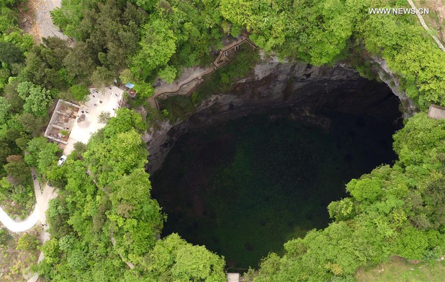 Aerial photo taken on May 3, 2019 shows the Luoquanyan sinkhole, which measures 290 meters in depth, in Xuan\'en County, central China\'s Hubei Province. (Xinhua/Song Wen)