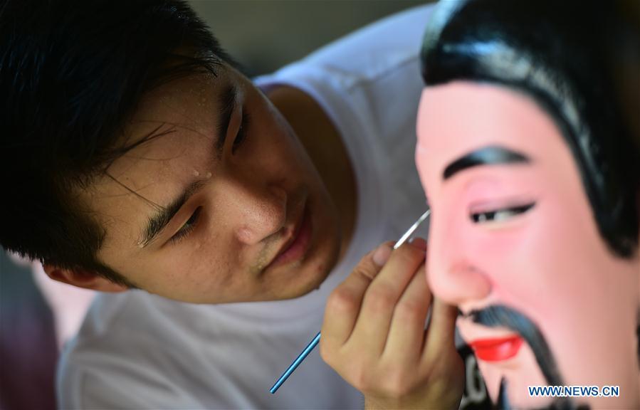 Xu Mingsheng, a craftsman born in the 1990s, makes a clay sculpture at his studio in Daixi Township of Huzhou City, east China\'s Zhejiang Province, Aug. 6, 2018. After graduating from China Academy of Art in 2016, Xu and his wife Zhu Yue returned to Xu\'s hometown in Daixi Township to inherit the handicraft of clay sculpture from his father. The couple established local reputation and receive hundreds of orders annually. They also teach children clay sculpture techniques in their studio for free. A nation will prosper only when its young people thrive; a country will be full of hope and have a great tomorrow only when its younger generations have ideals, ability, and a strong sense of responsibility. Young people always play a vanguard role in realizing national rejuvenation, which is the mission of the Chinese youth in the new era. In China many young people realize the value of life through hard work. They are writing a brilliant chapter worthy of our times in their efforts to take advantage of their youthful vigor, explore life and contribute to society. (Xinhua/Zhao Dingzhe)