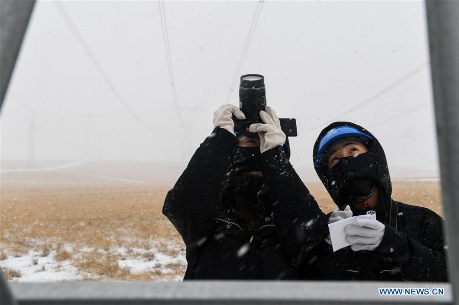 Wang Jiayu (L) and Wang Tongxing check the situation on an ultra-high voltage electricity pylon in the suburb of Xilinhot, north China\'s Inner Mongolia Autonomous Region, Oct. 27, 2018. Ten female technicians born in the 1990s from the Operation and Inspection Center of Power Transmission in Xilinhot have been working in the field of ultra-high voltage power lines after graduation. A nation will prosper only when its young people thrive; a country will be full of hope and have a great tomorrow only when its younger generations have ideals, ability, and a strong sense of responsibility. Young people always play a vanguard role in realizing national rejuvenation, which is the mission of the Chinese youth in the new era. In China many young people realize the value of life through hard work. They are writing a brilliant chapter worthy of our times in their efforts to take advantage of their youthful vigor, explore life and contribute to society. (Xinhua/Liu Lei)