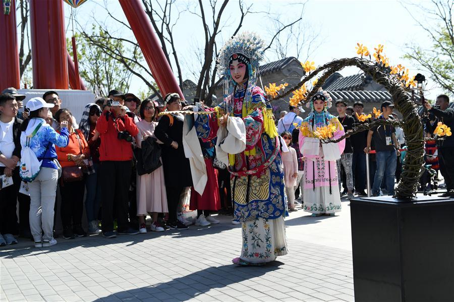 Artists perform at the Beijing Garden at the International Horticultural Exhibition 2019 Beijing in Yanqing District of Beijing, capital of China, May 1, 2019. Beijing International Horticultural Exhibition welcomed its first tourist peak by serving more than 320,000 tourists during the four-day May Day holiday, the organizer said Saturday. Some 132 activities, including float parades, world ethnic and folk cultural performances, and culture and art carnivals staged by central and eastern European countries, were held during the holiday. With the theme of \