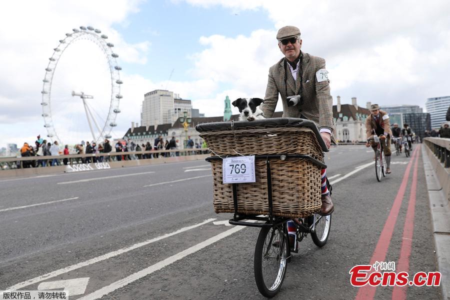 Participants ride their bicycles as they take part in the annual Tweed Run across London, Britain May 4, 2019. They ride through London\'s historic streets, stopping mid way for a picnic and ending with a traditional British \