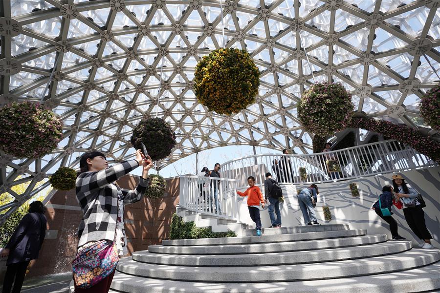 Tourists visit the Shanghai Garden of the International Horticultural Exhibition 2019 Beijing in Yanqing District of Beijing, capital of China, May 1, 2019. Beijing International Horticultural Exhibition welcomed its first tourist peak by serving more than 320,000 tourists during the four-day May Day holiday, the organizer said Saturday. Some 132 activities, including float parades, world ethnic and folk cultural performances, and culture and art carnivals staged by central and eastern European countries, were held during the holiday. With the theme of \