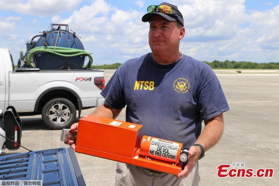 National Transportation Safety Board (NTSB) investigator Dan Boggs holds the flight data recorder recovered from the Miami Air International Boeing 737-800 that overran the runway at NAS Jacksonville and came to rest in the St Johns River in Jacksonville, Florida, U.S., May 4, 2019. (Photo/Agencies)
