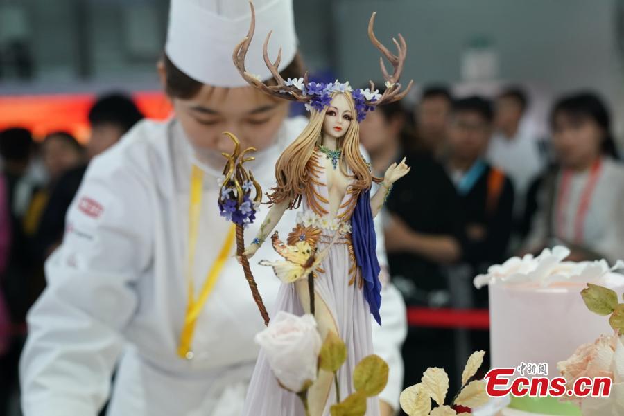 Participants compete in the 20th National Baking Skills Competition held at the Shanghai New International Expo Center, May 6, 2019. Eighty bakers from across the country took part in the competition organized by the China Association of Bakery and Confectionery Industry as well as other career guidance and industrial agencies. (Photo: China News Service/Wang Xin)