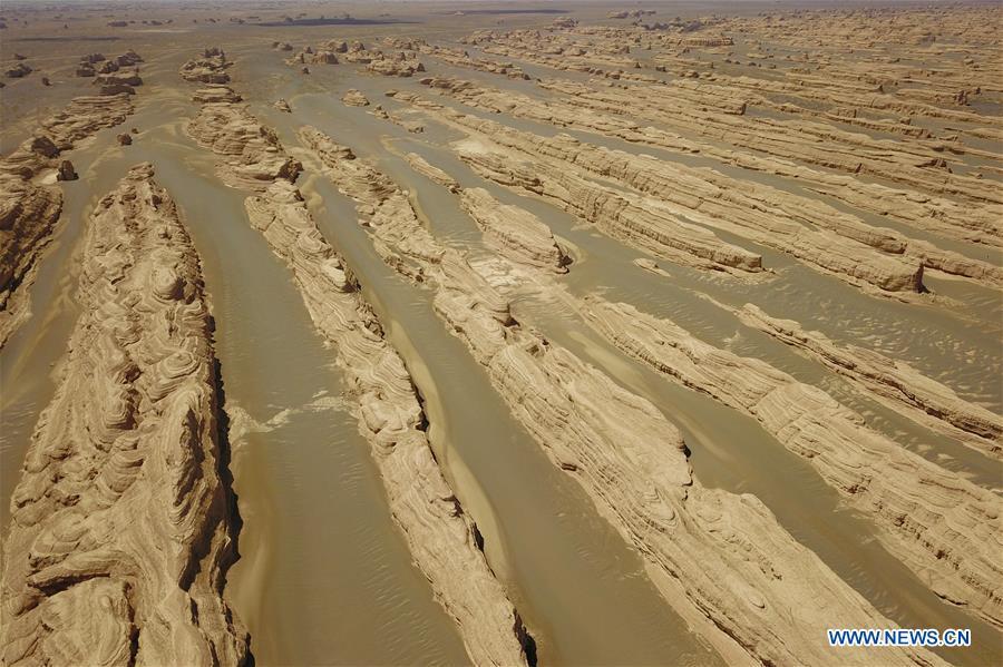Aerial photo taken on May 8, 2019 shows the scenery of Dunhuang Yardang National Geopark after a rain in Dunhuang, northwest China\'s Gansu Province. (Xinhua/Fan Peishen)