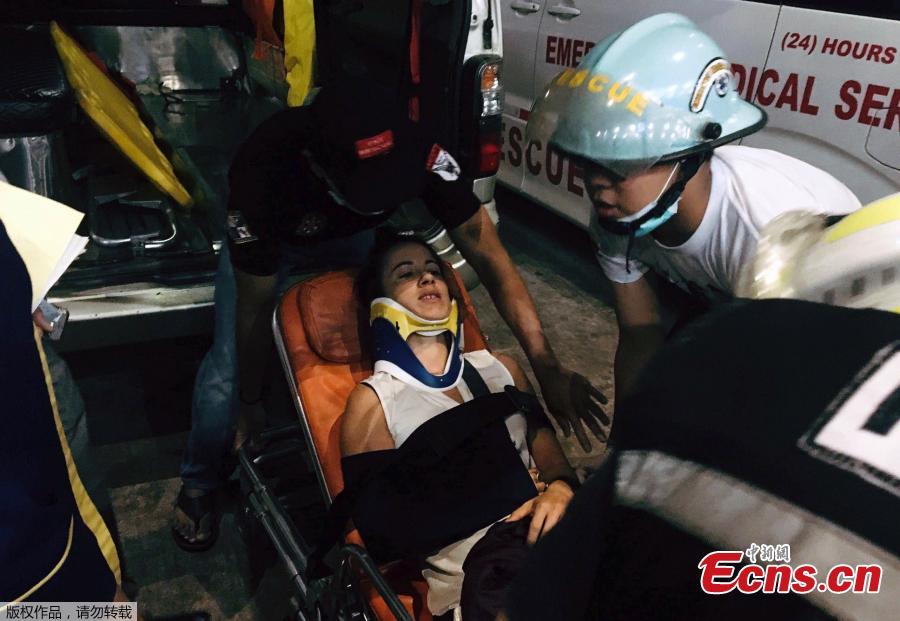 An injured person is carried on a stretcher at the Yangon International Airport in Yangon, Myanmar, May 8, 2019. Some 18 people including five crew members were injured after a passenger plane of the Biman Bangladesh airlines skidded off the runway at Myanmar\'s Yangon International Airport (YIA) on Wednesday, said the Department of Civil Aviation Myanmar.  (Photo/Agencies)