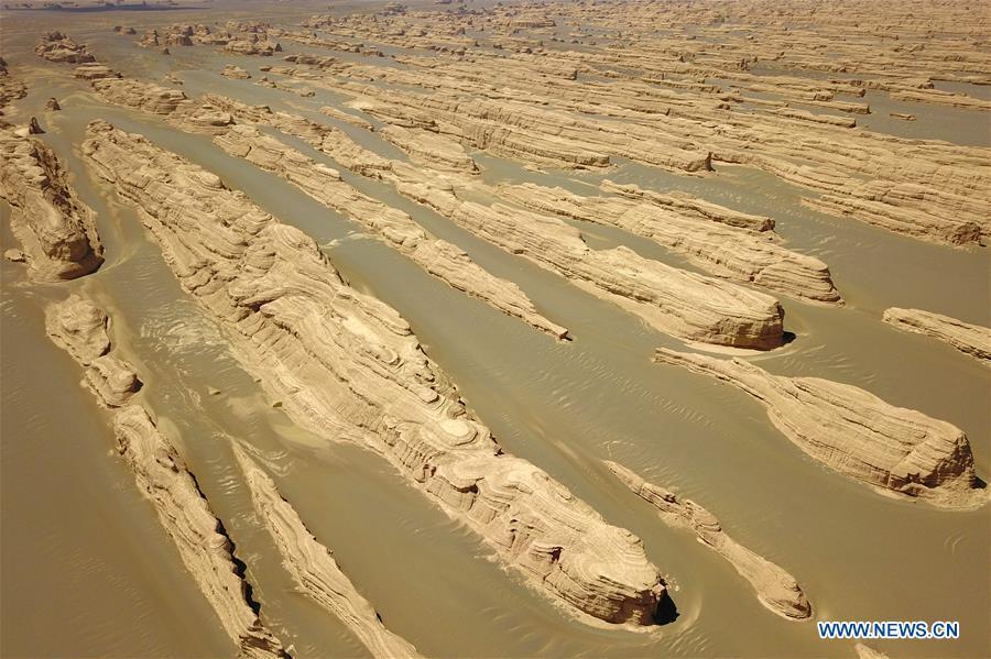 Aerial photo taken on May 8, 2019 shows the scenery of Dunhuang Yardang National Geopark after a rain in Dunhuang, northwest China\'s Gansu Province. (Xinhua/Fan Peishen)