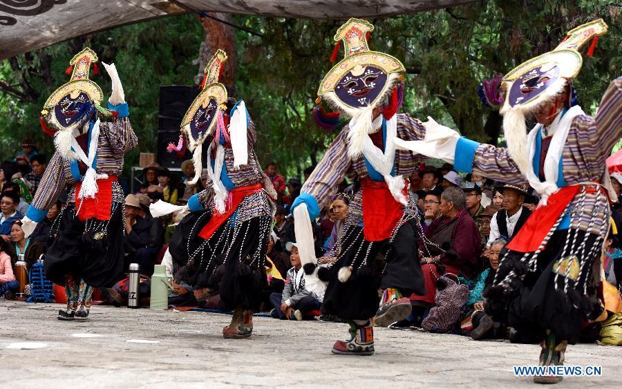 Troupers perform Tibetan Opera at Dzongyab Lukhang Park in Lhasa, capital of southwest China\'s Tibet Autonomous Region, Aug. 16, 2015. China will hold the Conference on Dialogue of Asian Civilizations starting from May 15. Under the theme of \