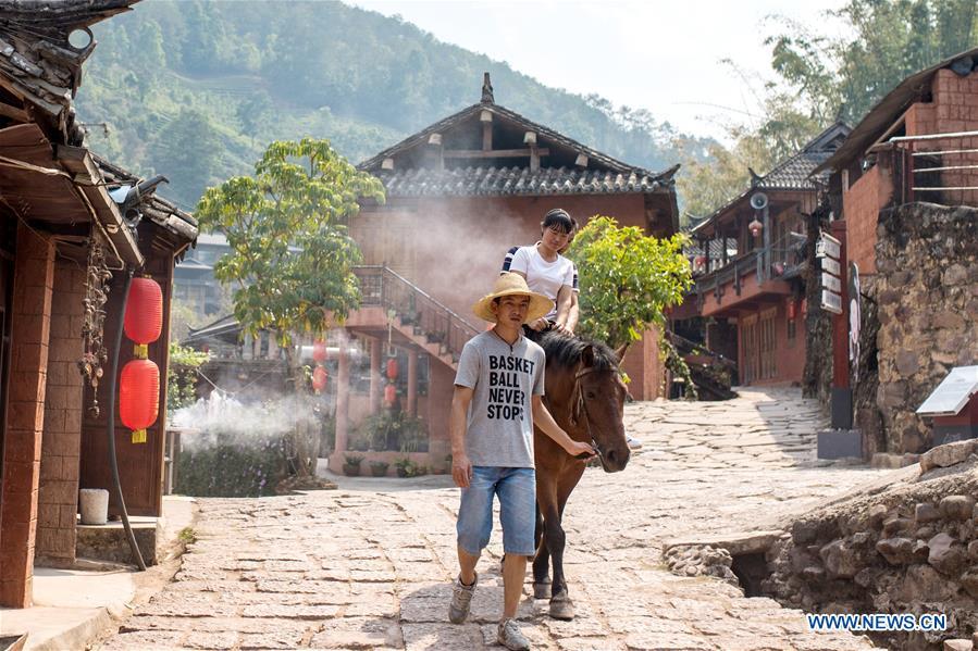 Visitors experience horse riding in Tongxin Township, once a stop along the ancient Tea Horse Road, in Hani and Yi Autonomous County of Ning\'er, Pu\'er City, southwest China\'s Yunnan Province, on April 14, 2019. As an important part of Asian culture, tea is a special bond among Asian countries to deepen friendship and boost mutual exchanges. China will hold the Conference on Dialogue of Asian Civilizations starting from May 15. Under the theme of \