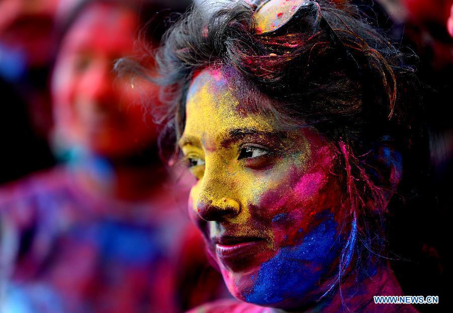Women with their faces smeared with colored powder take part in a celebration of the Holi Festival in Yangon, Myanmar, March 20, 2019. China will hold the Conference on Dialogue of Asian Civilizations starting from May 15. Under the theme of \