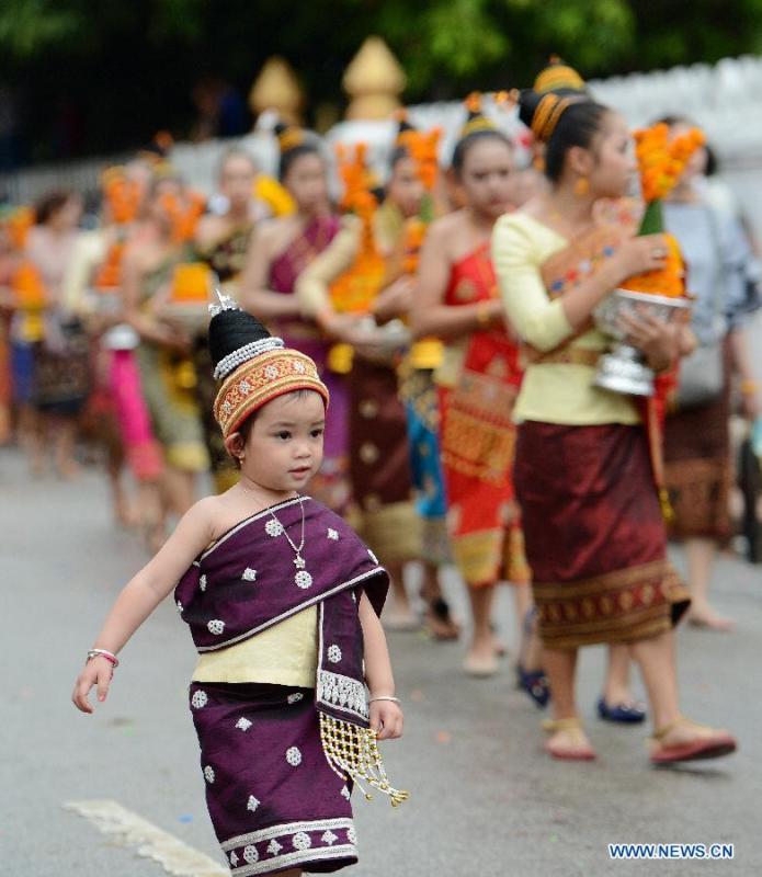 A girl dressed in traditional costume is seen in Luang Prabang, Laos, April 15, 2018. China will hold the Conference on Dialogue of Asian Civilizations starting from May 15. Under the theme of \