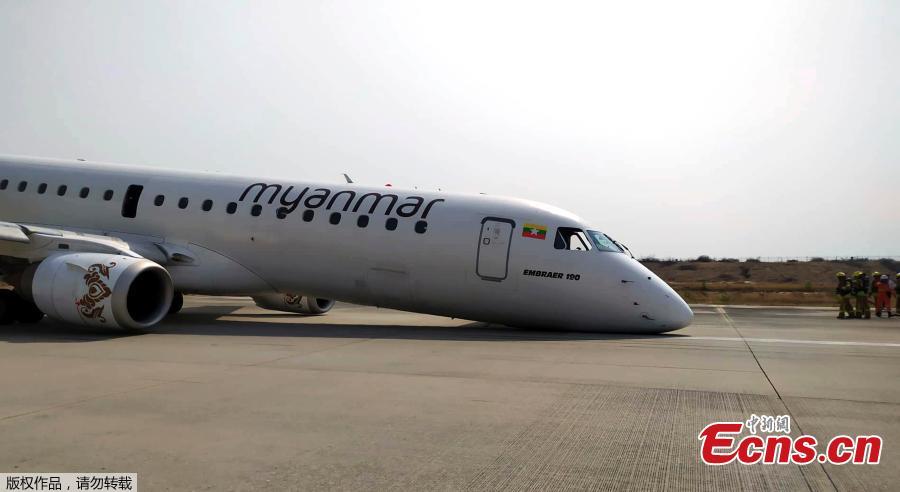 A Myanmar National Airlines flight to Mandalay International Airport makes an emergency landing without its front landing gear, May 12, 2019. No one on the plane was injured. (Photo/Agencies)