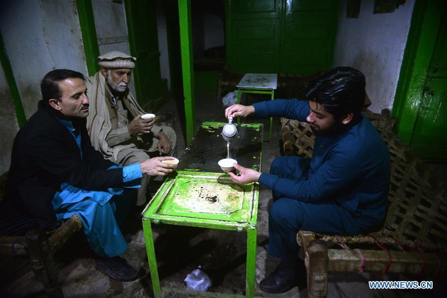 People drink tea, locally known as \