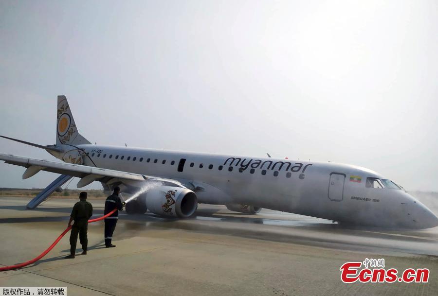 Rescue team gather near a plane of Myanmar National Airline (MNA) after an accident at Mandalay International airport Sunday, May 12, 2019, in Mandalay, Myanmar. (Photo/Agencies)