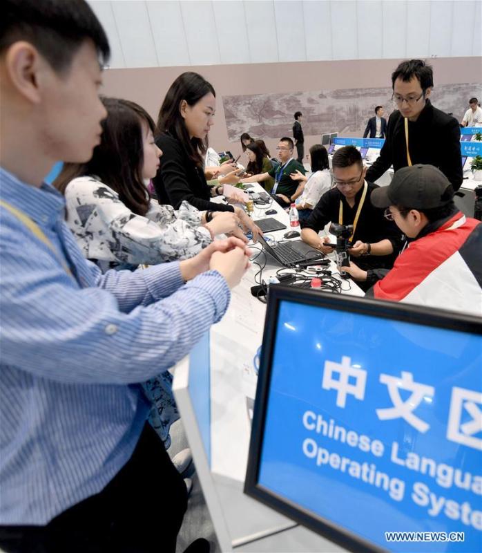 Reporters are seen at the media working area of the media center of the Conference on Dialogue of Asian Civilizations in the China National Convention Center in Beijing, capital of China, May 14, 2019. The Conference on Dialogue of Asian Civilizations will open on Wednesday. (Xinhua/Wang Yuguo)