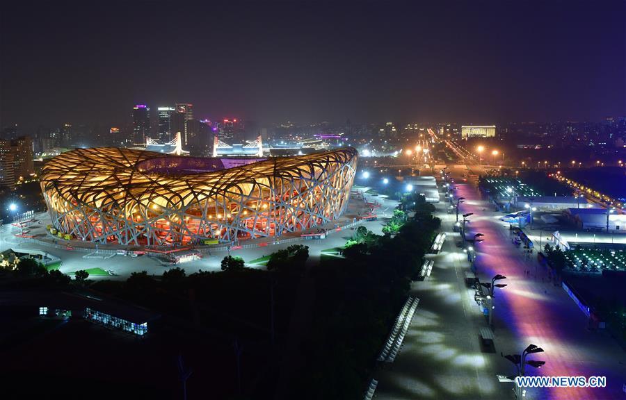 Photo taken on May 14, 2019 shows the night view of the National Stadium, also known as the Bird\'s Nest, in Beijing, capital of China. Roads and buildings were illuminated Tuesday evening before the upcoming Conference on Dialogue of Asian Civilizations (CDAC) in Beijing. (Xinhua/Li He)