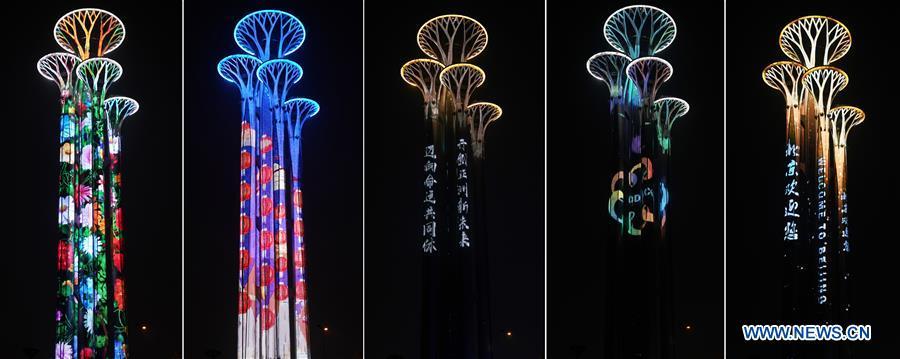 Combo photo taken on May 14, 2019 shows the night view of the Olympic Tower in Beijing, capital of China. Roads and buildings were illuminated Tuesday evening before the upcoming Conference on Dialogue of Asian Civilizations (CDAC) in Beijing. (Xinhua/Ju Huanzong)