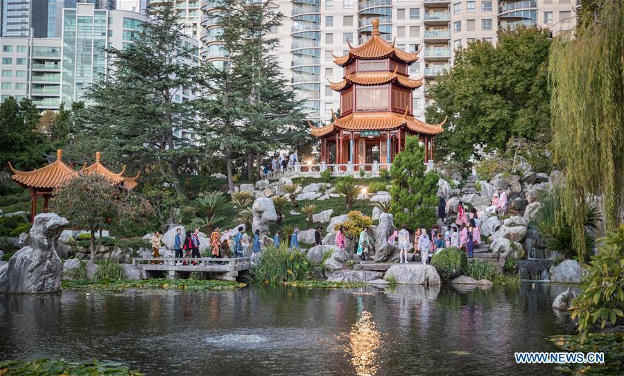 Models wearing creations by Double Rainbouu pose during Fashion Week Australia at the Chinese Garden of Friendship in Sydney, Australia, May 15, 2019. (Xinhua/Zhu Hongye)