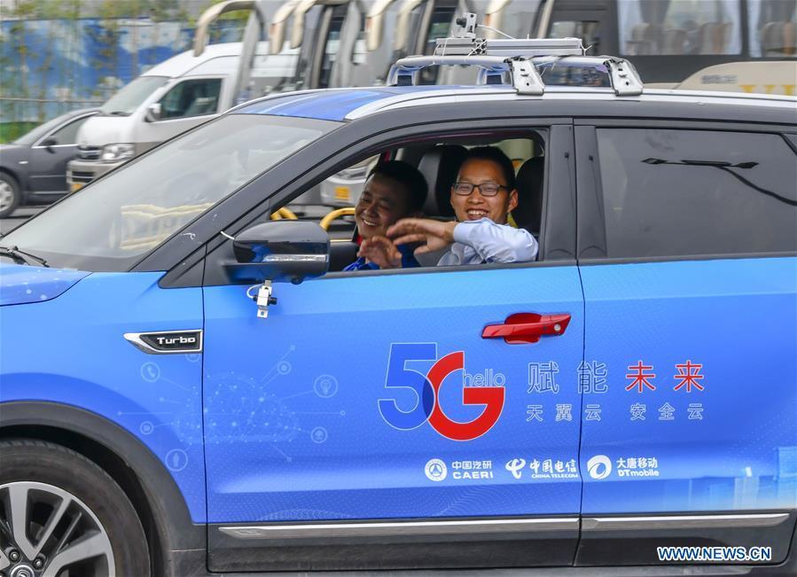 A car is controlled by a remote operator during a test run in Chongqing, southwest China, May 15, 2019. A remote-controlled car powered by the 5G network completed a test run on Wednesday in Chongqing. During the test run, a remote operator was able to control the car while watching the live feed of road conditions supported by the 5G network. (Xinhua/Liu Chan)