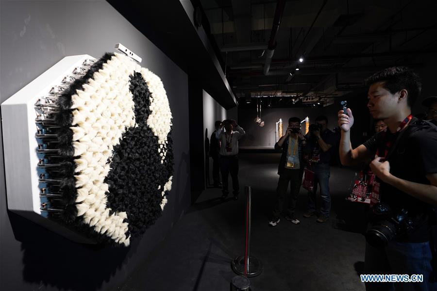 Visitors view an art work during the Asian Digital Art Exhibition held in Beijing, capital of China, May 16, 2019. The exhibition, part of the cultural activities of the Conference on Dialogue of Asian Civilizations, kicked off on Thursday. Works of 30 artists from 12 countries and regions are on show during the exhibition. (Xinhua/Ju Huanzong)