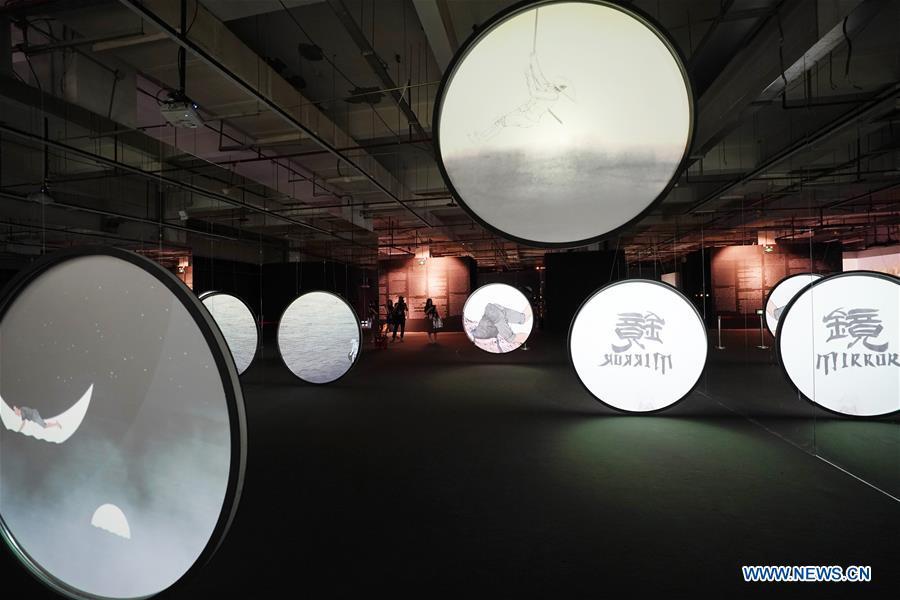 Visitors view an art work during the Asian Digital Art Exhibition held in Beijing, capital of China, May 16, 2019. The exhibition, part of the cultural activities of the Conference on Dialogue of Asian Civilizations, kicked off on Thursday. Works of 30 artists from 12 countries and regions are on show during the exhibition. (Xinhua/Ju Huanzong)