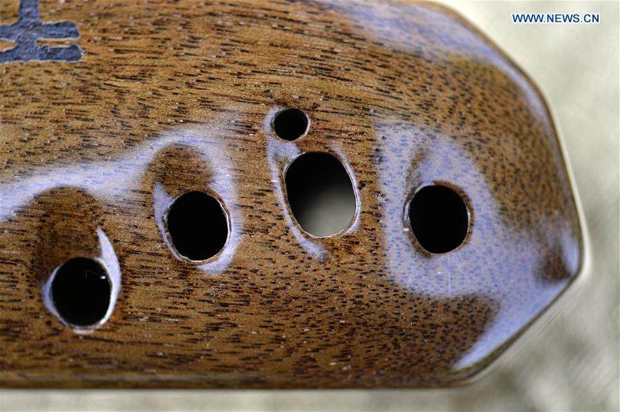 Ocarina, a flute-like instrument, is pictured at a studio in Xingtai, north China\'s Hebei Province, May 14, 2019. Ocarina is a wind musical instrument typically having an enclosed oval body with finger holes and a projecting mouthpiece. It is traditionally made of clay or ceramic, but other materials including wood and horn are used. It is an ancient instrument and can be traced back to many different cultures. (Xinhua/Mu Yu)