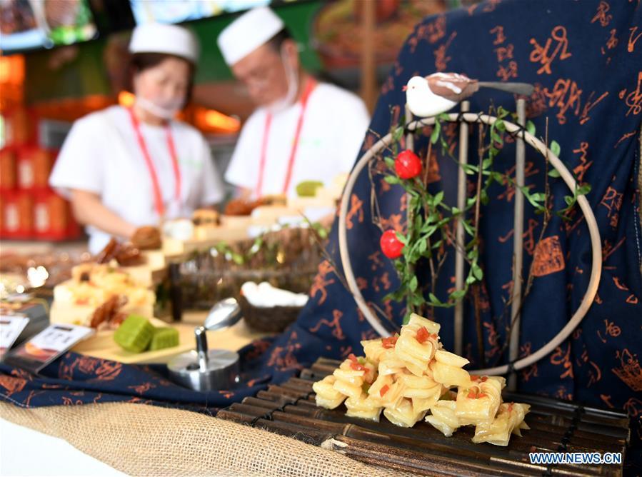 Snacks are seen during the Asian Cuisine Festival at the Olympic Park in Beijing, capital of China, May 16, 2019. The week-long Asian Cuisine Festival, as part of the Conference on Dialogue of Asian Civilizations (CDAC), was held in four cities of Beijing, Hangzhou, Chengdu and Guangzhou. (Xinhua/Zhang Chenlin)