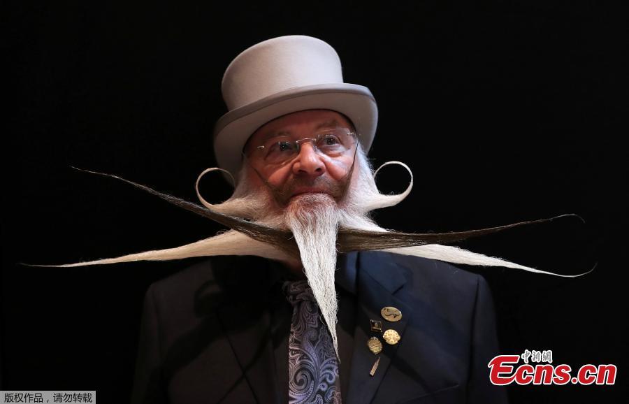 A participant of the international World Beard and Moustache Championships poses before taking part in one of the 17 categories of beard and moustache styles competing in Antwerp, Belgium May 18, 2019.(Photo/Agencies)