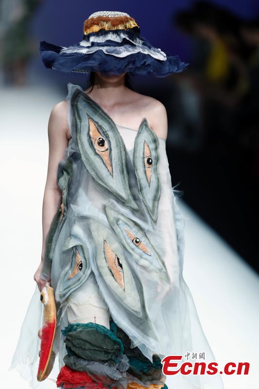 A model wears a creation by a newcomer designer during the China Graduate Fashion Week in Beijing, May 19, 2019. The seven-day event concluded on Sunday night, with the announcement of ten winning newcomer designers. (Photo: China News Service/Sheng Jiapeng)