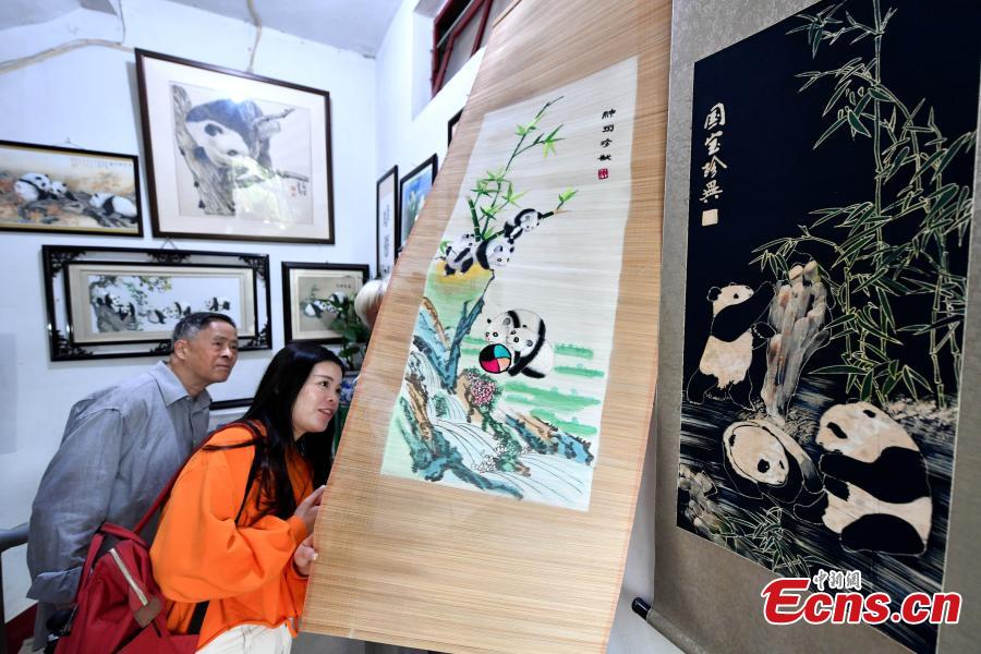 Collector Li Zhiqi shows his collection of giant panda-themed items in Fuzhou City, Fujian Province, May 21, 2019. Li has amassed a trove of nearly 10,000 items featuring the iconic bear, including stamps, dolls, bookmarks, and mugs. (Photo: China News Service/Lyu Ming)
