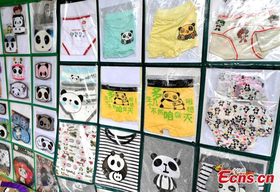 Collector Li Zhiqi shows his collection of giant panda-themed items in Fuzhou City, Fujian Province, May 21, 2019. Li has amassed a trove of nearly 10,000 items featuring the iconic bear, including stamps, dolls, bookmarks, and mugs. (Photo: China News Service/Lyu Ming)
