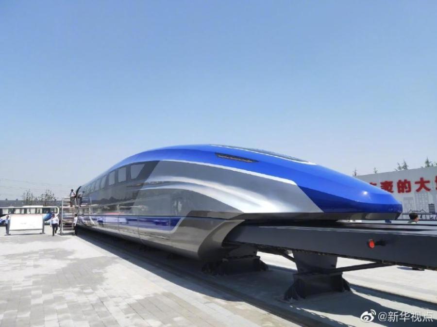 China rolled off production line a prototype magnetic-levitation train with a top speed of 600 km per hour in the eastern city of Qingdao on May 23, 2019. The debut of China\'s first high-speed maglev train testing prototype marks a major breakthrough for the country in high-speed maglev transit system. (Photo/Xinhua)