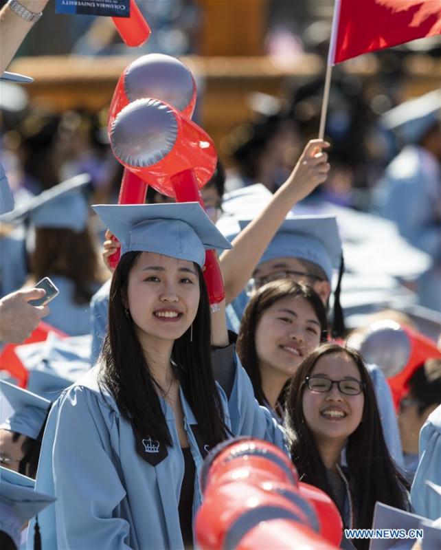 Graduate students from China attend the Columbia University Commencement ceremony in New York, the United States, May 22, 2019. The Columbia University Commencement ceremony of the 265th academic year took place on Wednesday. More than 17,000 students from Columbia\'s 18 schools and affiliates graduated this year. (Xinhua/Wang Ying)