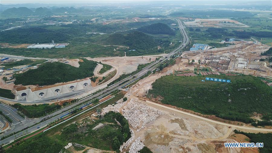 Aerial photo taken on May 19, 2019 shows the Tencent Guian Qixing Center (L) and the construction site of a Huawei Cloud data center in Gui\'an New Area of southwest China\'s Guizhou Province. In Guizhou Province, which hosts China\'s first state-level big data pilot zone, the integration of big data with sectors such as real economy, social management, civil service and rural revitalization has brought significant changes to people\'s life. According to statistics, Guizhou has more than 9,500 big data enterprises and many of them are active players on the global business stage. A 2019 whitepaper published by the China Academy of Information and Communications Technology indicates that Guizhou is taking advantage of big data in the course of its development, as both the growth of the province\'s digital economy and the growth of its employment in digital economy have ranked first in China. (Xinhua/Ou Dongqu)