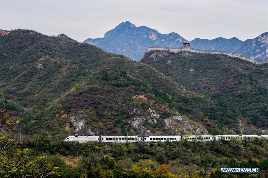 A train runs on the Juyongguan Pass section of the Beijing-Zhangjiakou railway in Beijing, capital of China, Oct. 25, 2015. (Xinhua/Yang Guang)