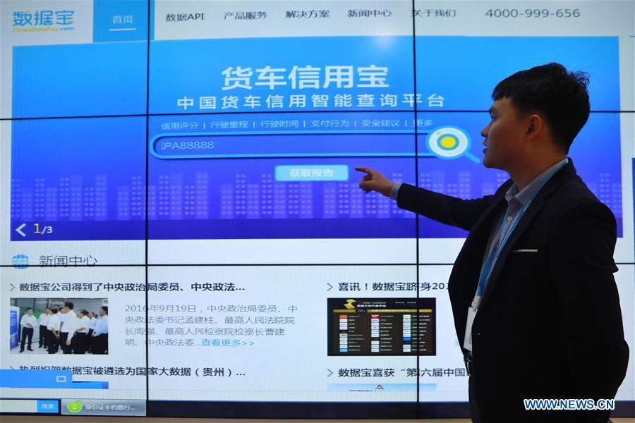 A network technology company staff member shows a truck credit inquiry platform in southwest China\'s Guizhou Province, May 20, 2019. In Guizhou Province, which hosts China\'s first state-level big data pilot zone, the integration of big data with sectors such as real economy, social management, civil service and rural revitalization has brought significant changes to people\'s life. According to statistics, Guizhou has more than 9,500 big data enterprises and many of them are active players on the global business stage. A 2019 whitepaper published by the China Academy of Information and Communications Technology indicates that Guizhou is taking advantage of big data in the course of its development, as both the growth of the province\'s digital economy and the growth of its employment in digital economy have ranked first in China. (Xinhua/Ou Dongqu)