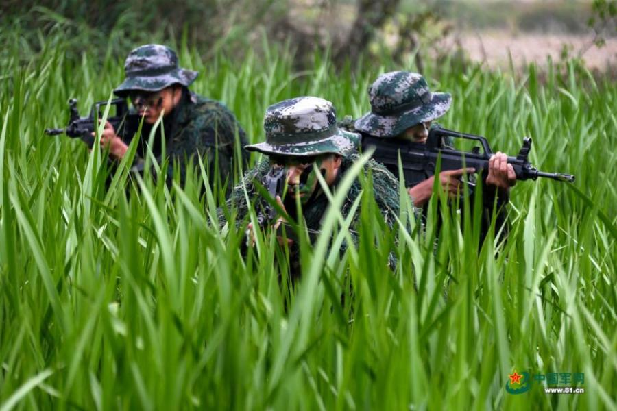 Army scouts undergo an intensive training at a military base in Easter Anhui Province. Soldiers needed to carry a load no less than 30 kilograms marching over a distance of 100 kilometres amid tens of other training programs. (Photo/81.cn)