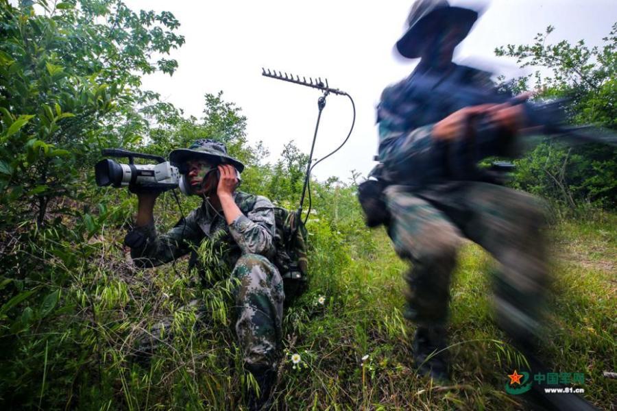 Army scouts undergo an intensive training at a military base in Easter Anhui Province. Soldiers needed to carry a load no less than 30 kilograms marching over a distance of 100 kilometres amid tens of other training programs. (Photo/81.cn)