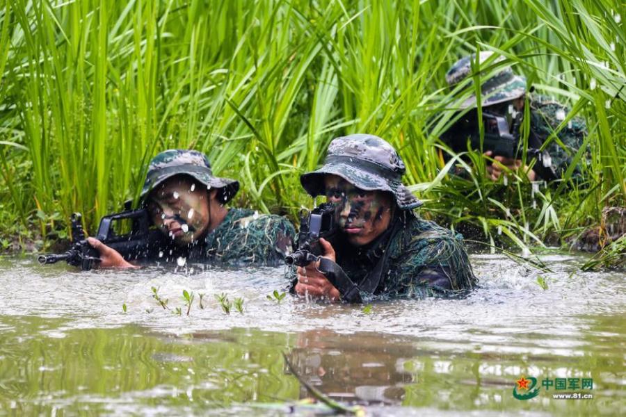 Army scouts undergo an intensive training at a military base in Easter Anhui Province. Soldiers needed to carry a load no less than 30 kilograms marching over a distance of 100 kilometres amid tens of other training programs. (Photo/81.cn)