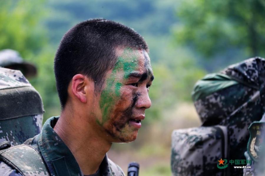 Army scouts undergo an intensive training at a military base in Easter Anhui Province. Soldiers needed to carry a load no less than 30 kilograms marching over a distance of 100 kilometres amid tens of other training programs. (Photo/81.cn)