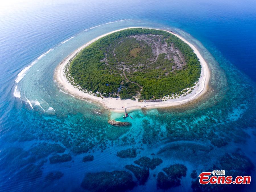 A view of Ganquan Island in the Xisha Yongle Islands group in South China\'s Hainan Province, May 22, 2019. Named after a freshwater well, the lush, oval-shaped island covers an area of 0.3 square kilometers. The remains of a settlement dating back to the Tang and Song dynasties was found there in March 1974, and the site was later listed as a national key cultural relics site. (Photo: China News Service/Luo Yunfei)