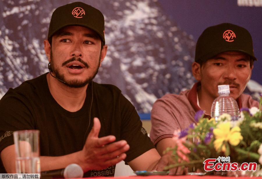 Mountaineer Nirmal Purja (L) speaks and Nepali mountaineer Mingma David Sherpa (R) looks on during a press conference in Kathmandu on May 28, 2019. Nirmal Purja has scaled six mountains peaks above 8 000 meters, including Mount Everest, over the last month as he attempts to summit the world\'s fourteen 8 000-meter peaks. (Photo/Agencies)