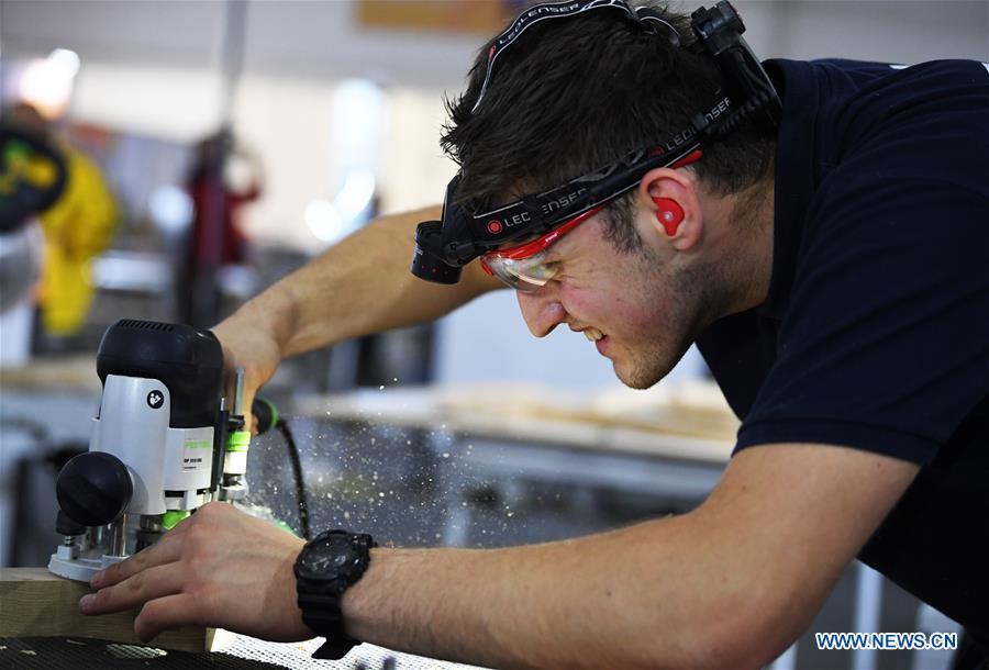 A contestant participates in the joinery competition during the Belt And Road International Skills Competition held in Chongqing International Expo Center in Chongqing, southwest China, May 29, 2019. (Xinhua/Wang Quanchao)