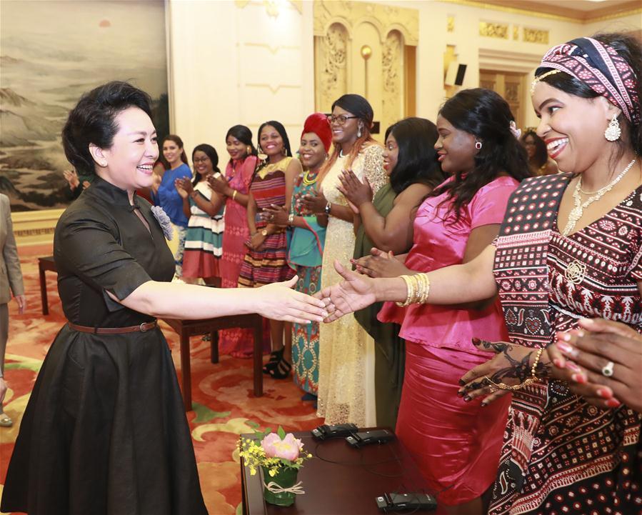 Peng Liyuan, wife of Chinese President Xi Jinping, meets with a group of international graduate students from China Women\'s University (CWU) at the Great Hall of the People in Beijing, capital of China, May 30, 2019. The students are from CWU\'s International Master\'s Program of Social Work in \