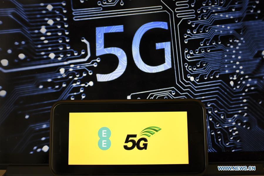 Photo taken on May 30, 2019 shows the logo of 5G network in London, Britain. Mobile network operator EE said on last Wednesday that it would launch Britain\'s first 5G service in six major cities on May 30th. (Xinhua/Han Yan)