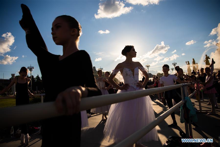 Ballet dancers get ready for a ballet master class by Nicolay Tsiskaridze during the World Ballet Holidays Festival in Moscow, Russia, on June 1, 2019. The World Ballet Holidays Festival is held from May 31 to June 2 at VDNH exhibition complex in Moscow. One of the highlights of the festival is an outdoor ballet class conducted by ballet dancer Nikolay Tsiskaridze. (Xinhua/Maxim Chernavsky)