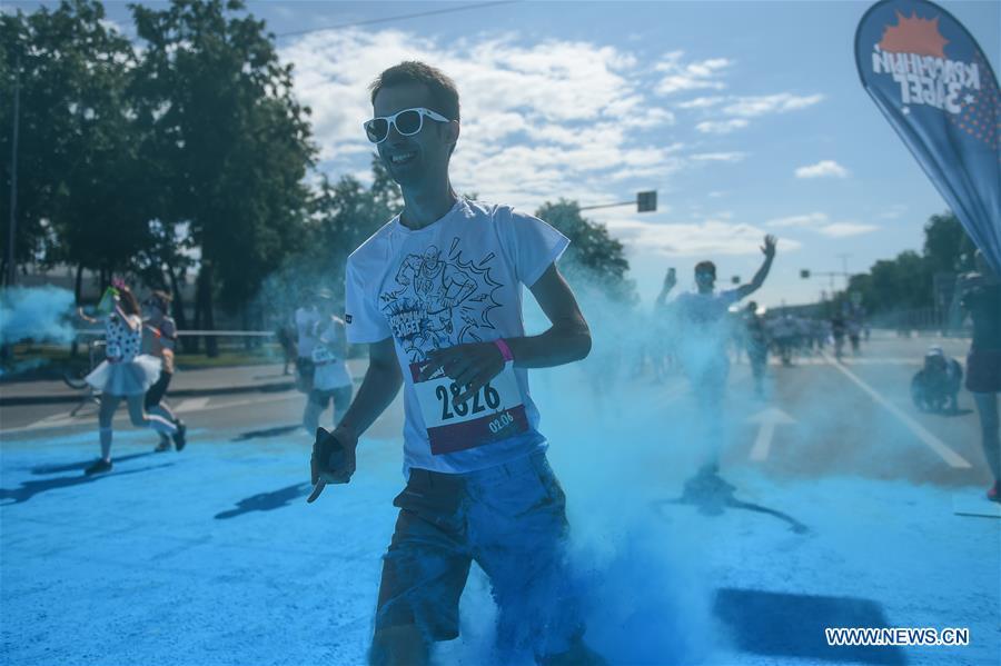 Participants run through colored powder during the annual color run in Moscow, Russia, June 2, 2019. (Xinhua/Evgeny Sinitsyn)
