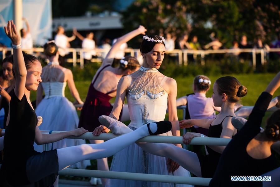 Dancers take part in a ballet master class by Nikolay Tsiskaridze during The World Ballet Holidays Festival in Moscow, Russia, on June 1, 2019. The World Ballet Holidays Festival is held from May 31 to June 2 at VDNH exhibition complex in Moscow. One of the highlights of the festival is an outdoor ballet class conducted by ballet dancer Nikolay Tsiskaridze. (Xinhua/Maxim Chernavsky)
