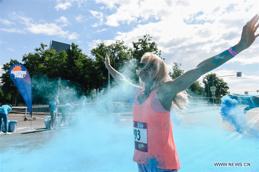 A participant runs through colored powder during the annual color run in Moscow, Russia, June 2, 2019. (Xinhua/Evgeny Sinitsyn)